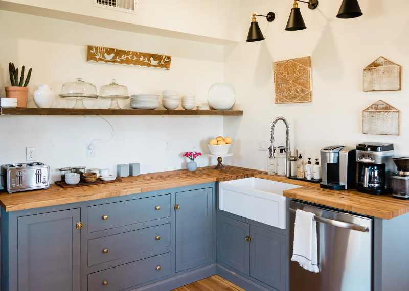 light blue cabinets with butcher block countertop