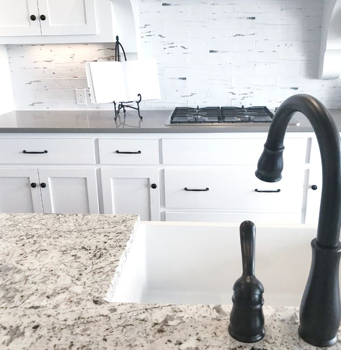 black faucet and white sink